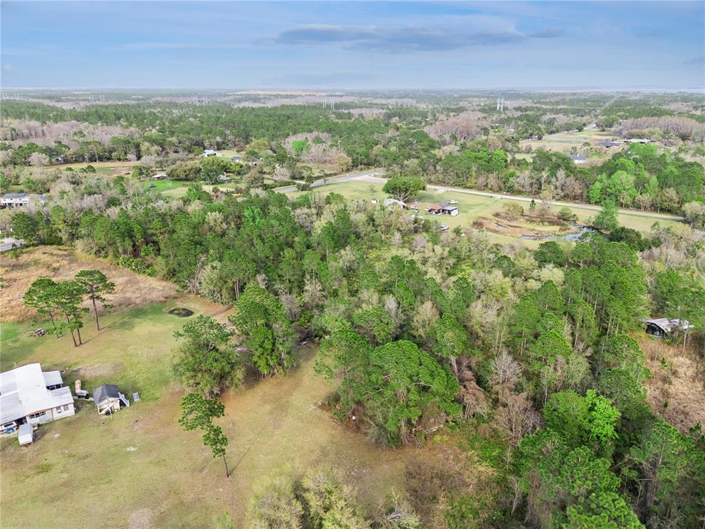 541 East Osceola Road Geneva, FL 32732 - Photo 23 of 31 a view of a lake with an outdoor space