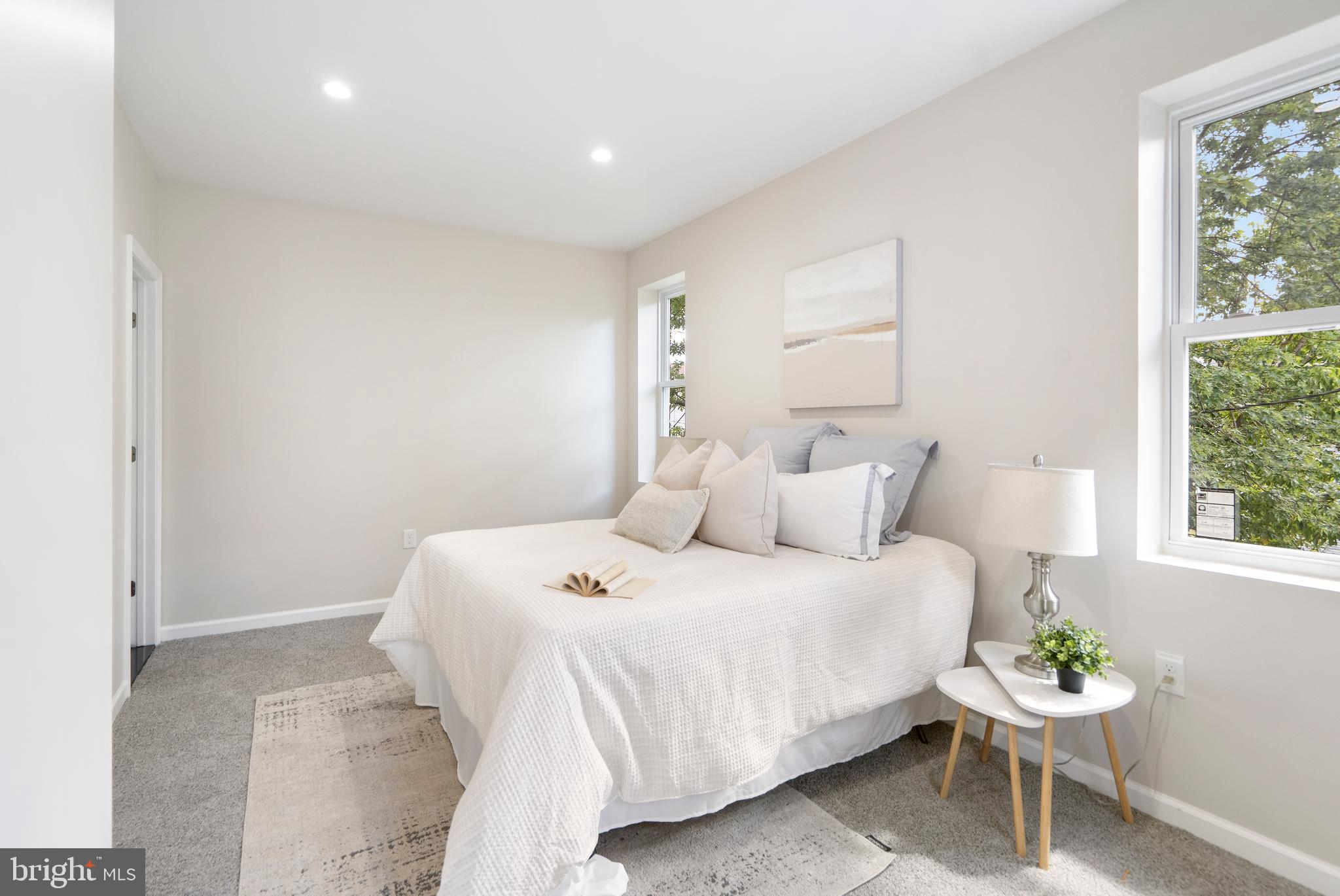 4011 Ridgewood Avenue Baltimore, MD 21215 - Photo 16 of 35 a bedroom with a bed and a window