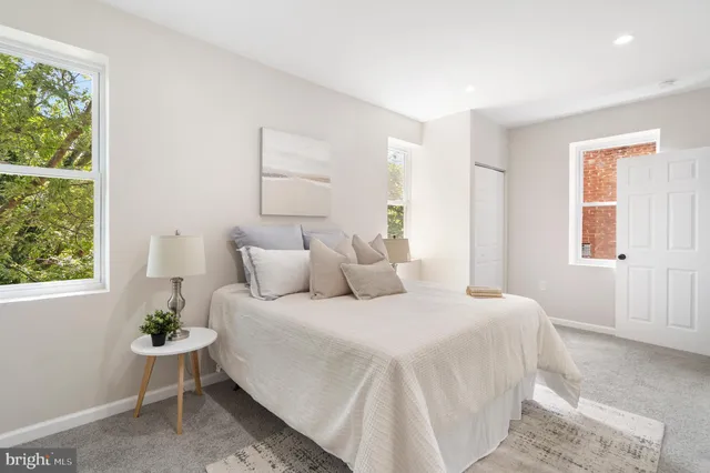 a bedroom with a bed and window