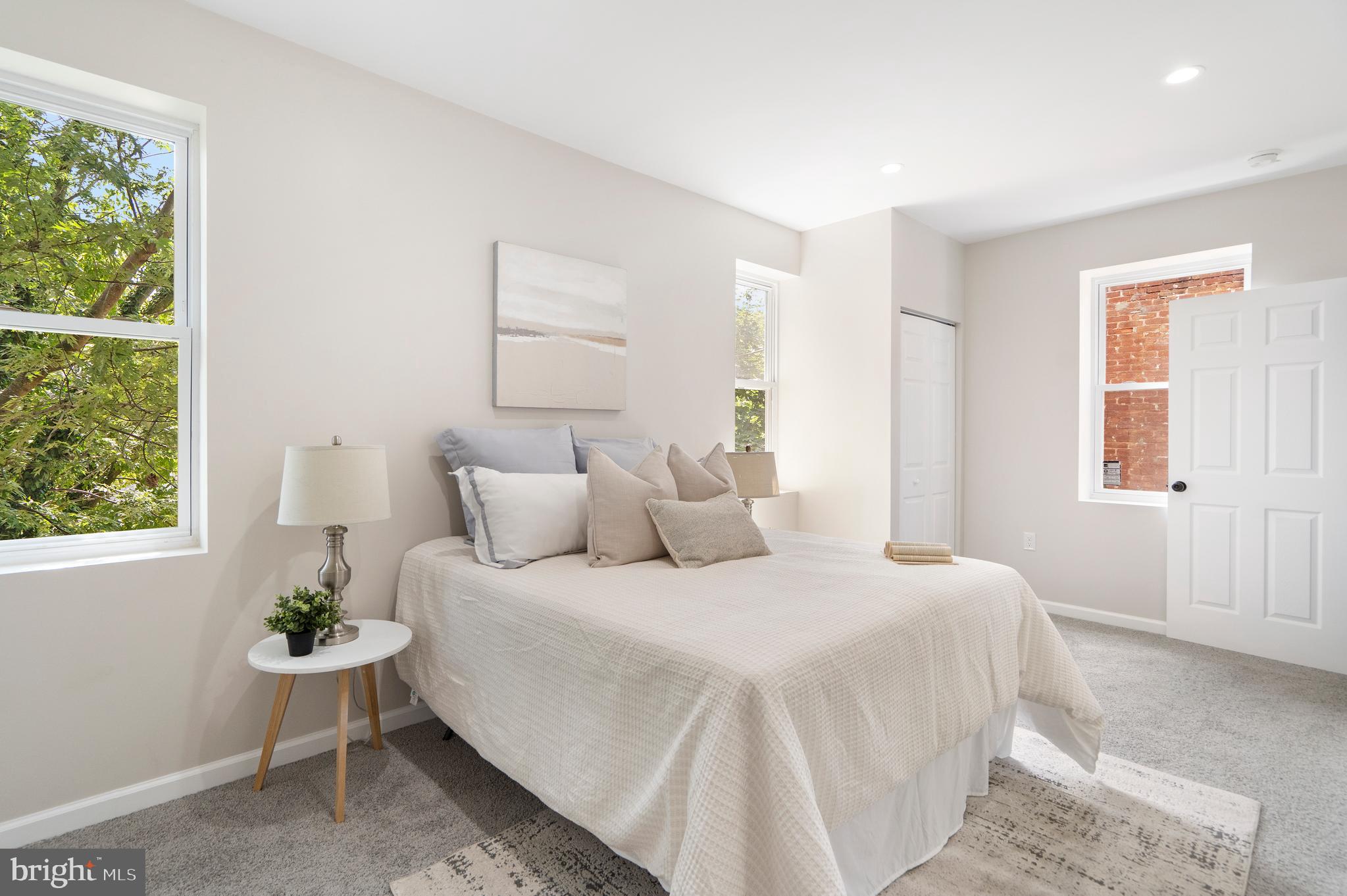 4011 Ridgewood Avenue Baltimore, MD 21215 - Photo 19 of 35 a bedroom with a bed and window