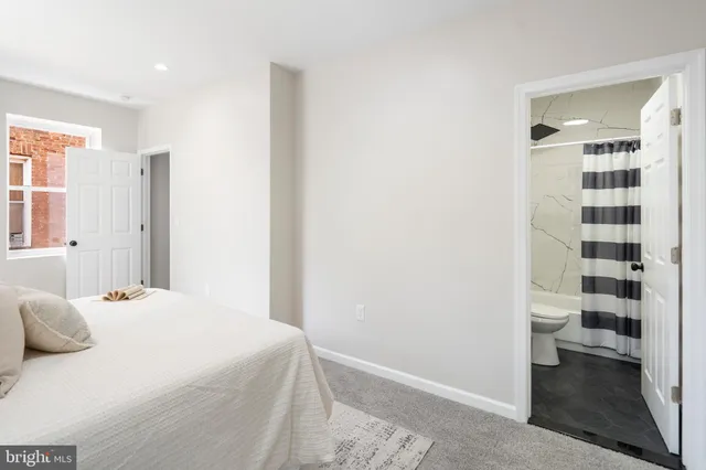 a bedroom with a bed and a walk in closet