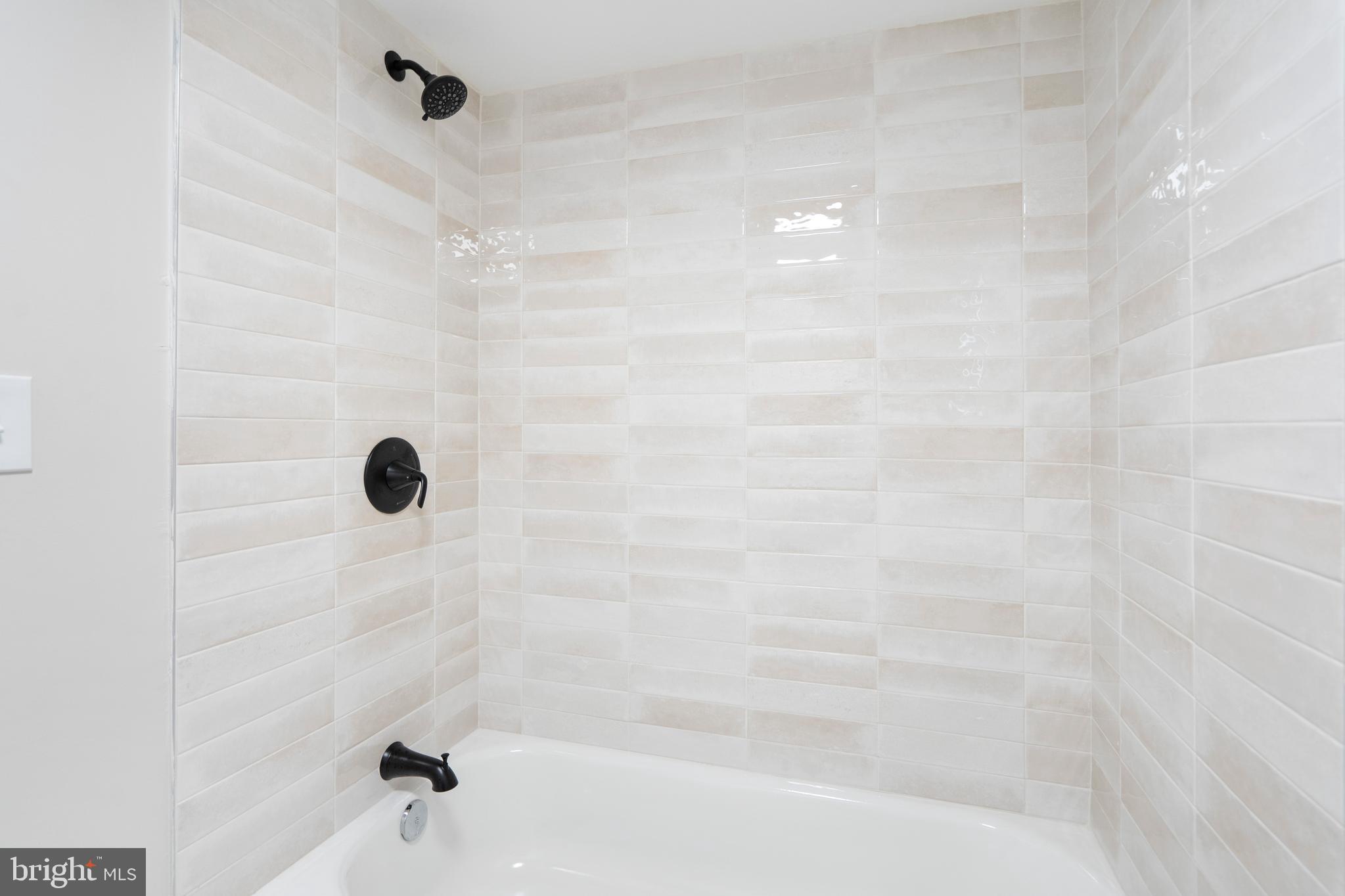 4011 Ridgewood Avenue Baltimore, MD 21215 - Photo 23 of 35 a bathroom with a shower