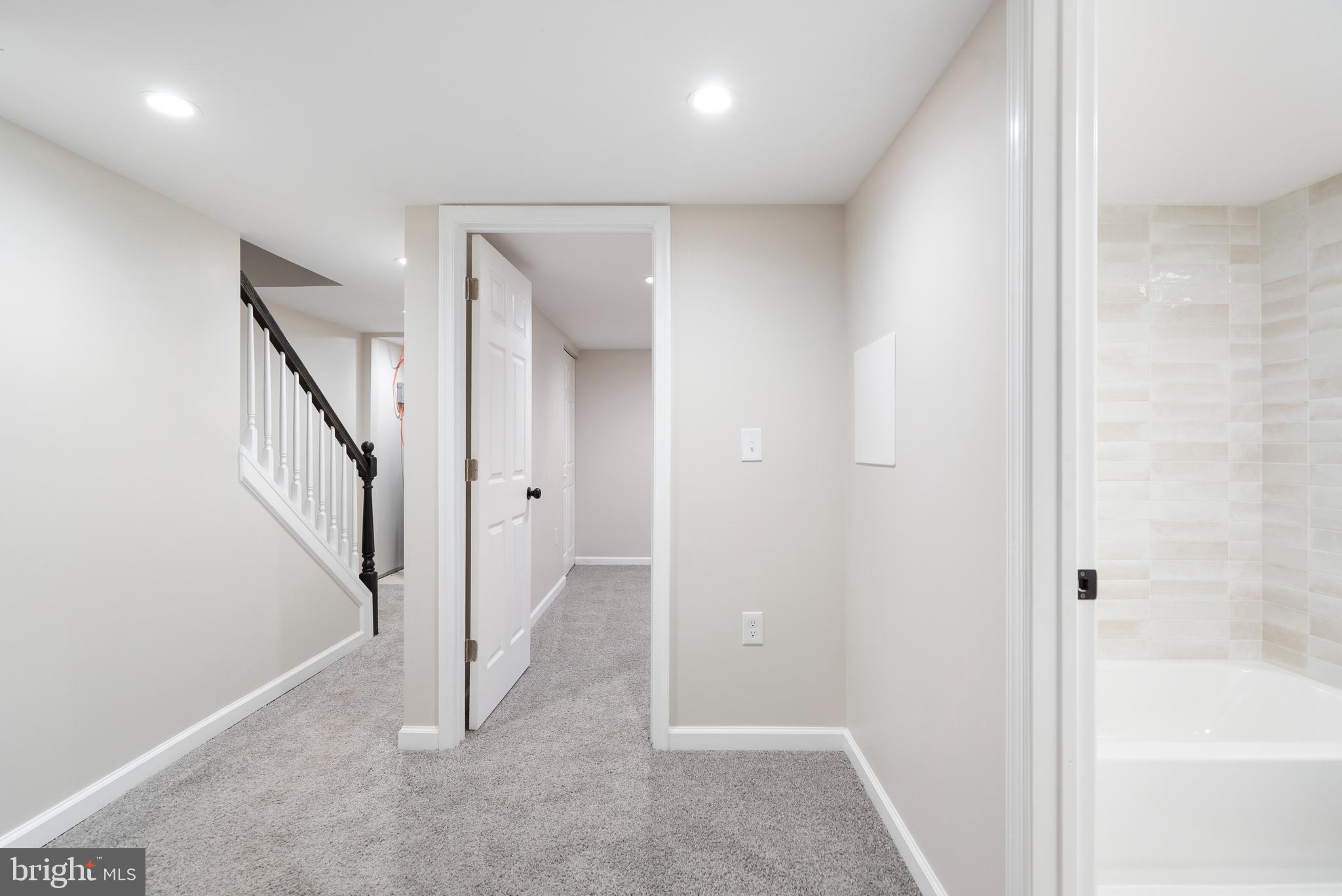 4011 Ridgewood Avenue Baltimore, MD 21215 - Photo 25 of 35 a view of a hallway with staircase