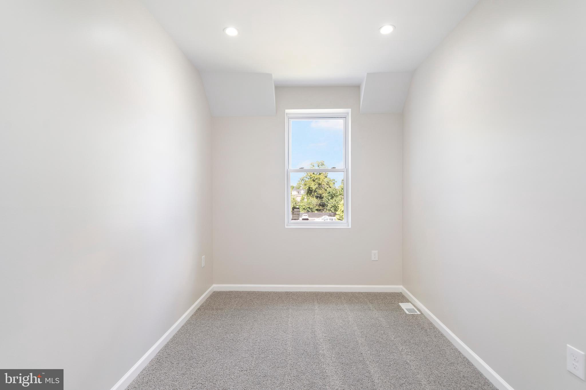 4011 Ridgewood Avenue Baltimore, MD 21215 - Photo 33 of 35 a view of an empty room with a window