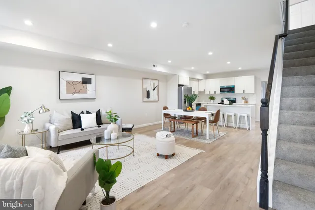 a living room with furniture and a table