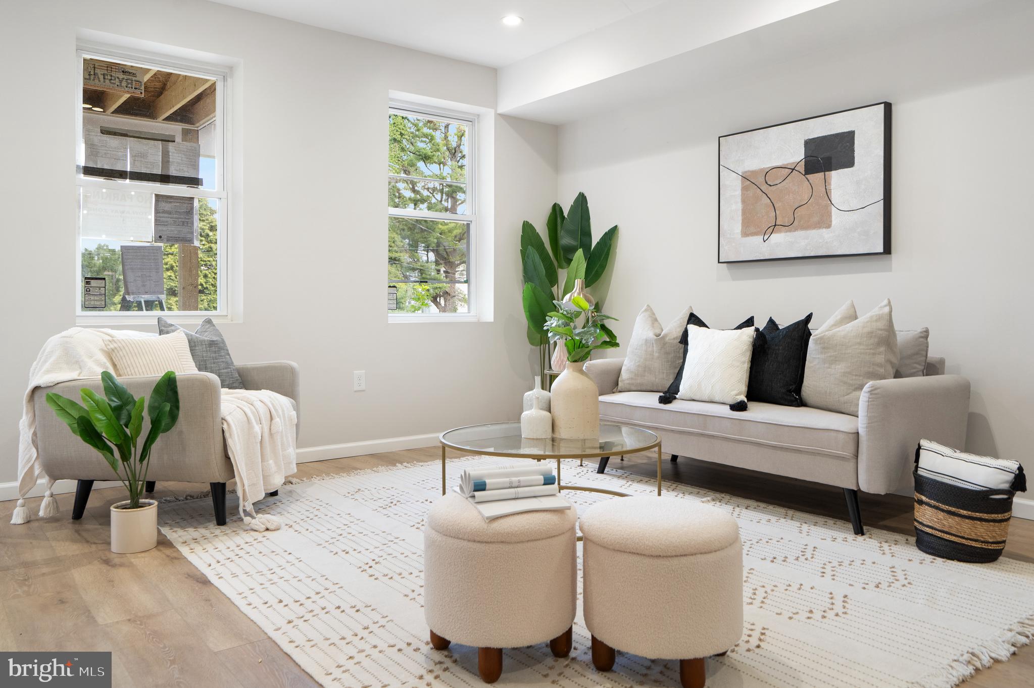 4011 Ridgewood Avenue Baltimore, MD 21215 - Photo 7 of 35 a living room with furniture and a potted plant