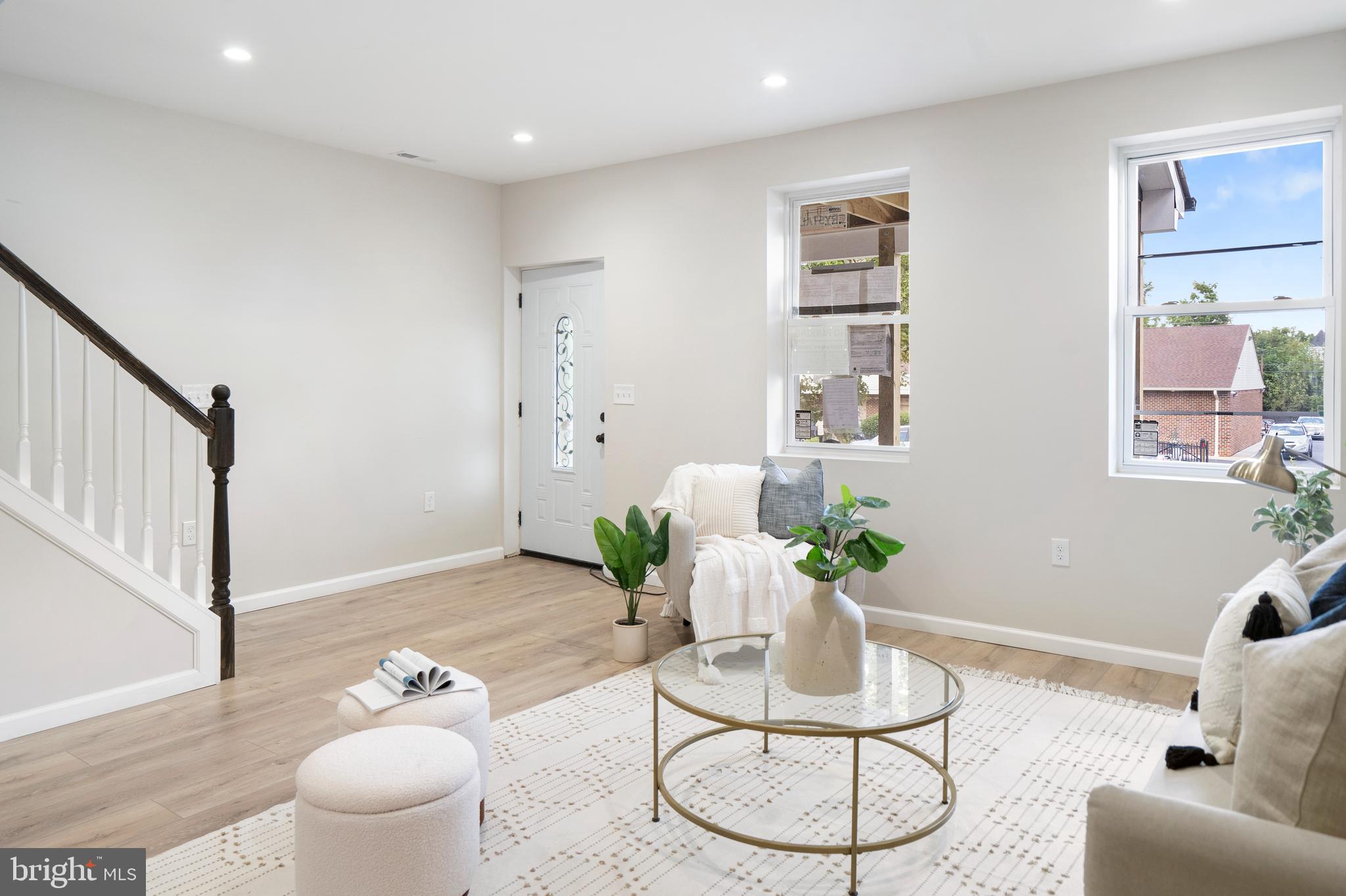 4011 Ridgewood Avenue Baltimore, MD 21215 - Photo 8 of 35 a living room with furniture and a potted plant