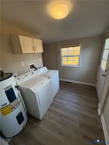 a room with a bed and a wooden floor