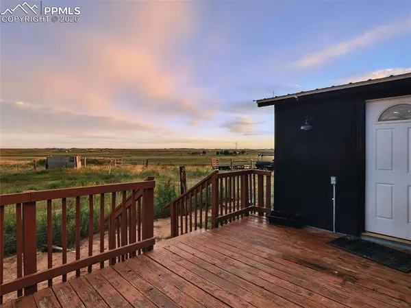 a view of a balcony with wooden floor