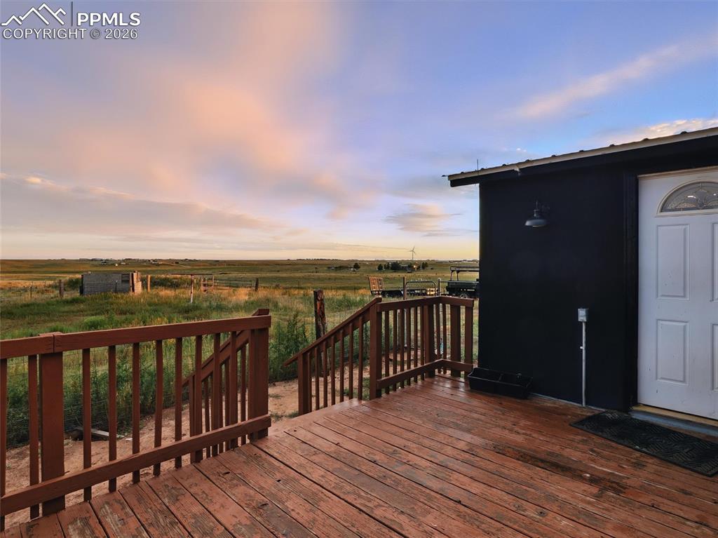 6615 Mulberry Road Calhan, CO 80808 - Photo 15 of 47 a view of a balcony with wooden floor