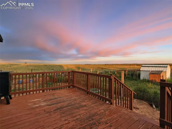 a view of balcony with wooden floor and city view