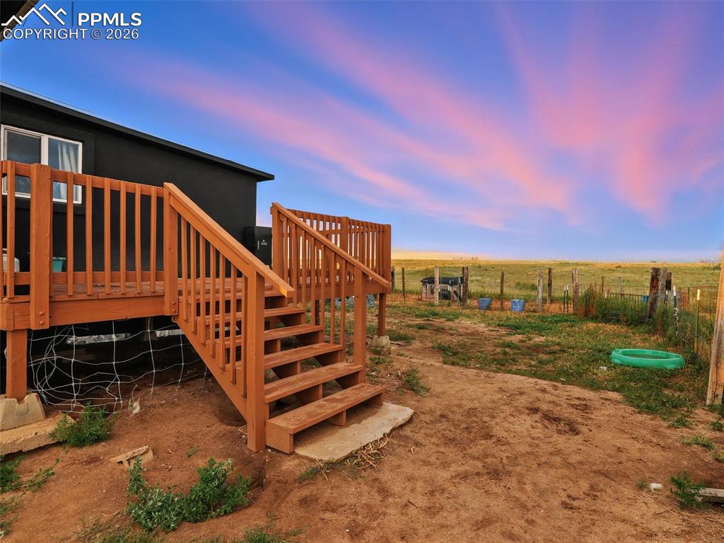 6615 Mulberry Road Calhan, CO 80808 - Photo 17 of 47 a view of a yard with wooden fence