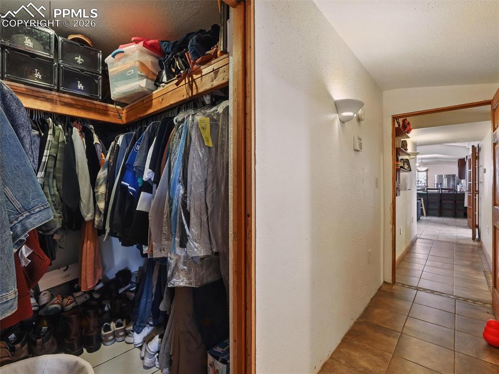 6615 Mulberry Road Calhan, CO 80808 - Photo 25 of 47 a view of walk in closet with clothes and shoes