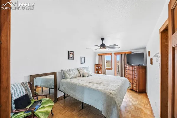 a bedroom with furniture and a bed