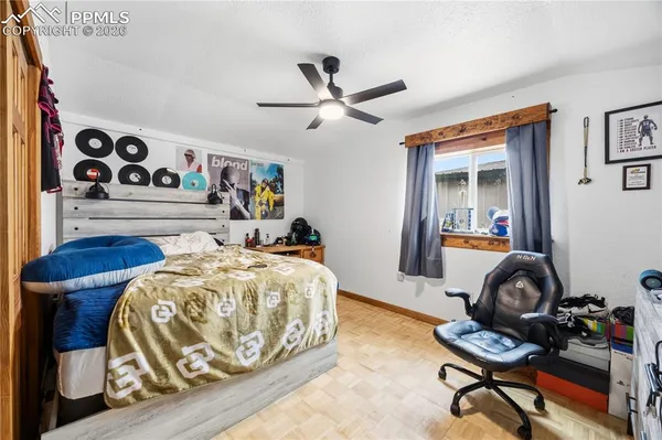 a bathroom with a sink a toilet a mirror and shower