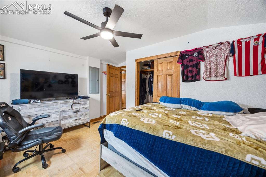 6615 Mulberry Road Calhan, CO 80808 - Photo 31 of 47 a bedroom with a bed and a flat screen tv
