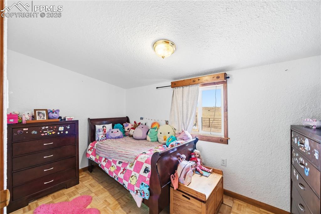 6615 Mulberry Road Calhan, CO 80808 - Photo 35 of 47 a bedroom with a bed and window