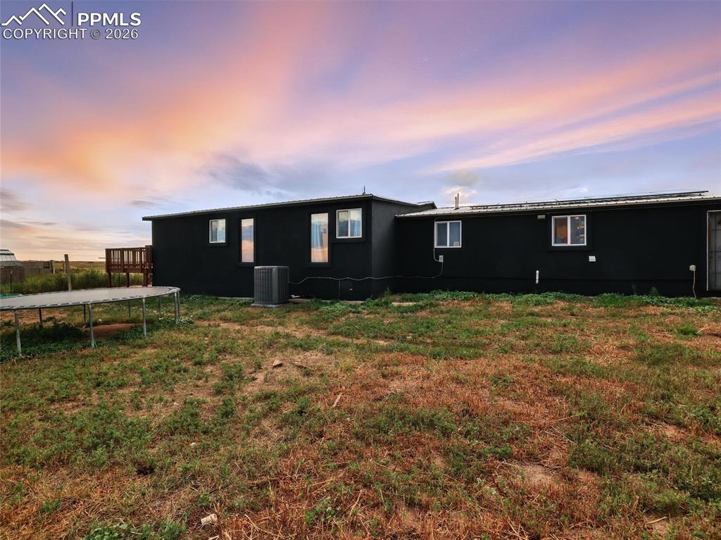 6615 Mulberry Road Calhan, CO 80808 - Photo 42 of 47 a view of a house with a yard