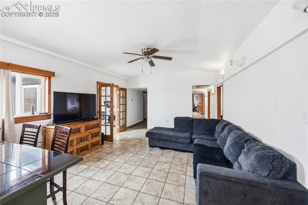 6615 Mulberry Road Calhan, CO 80808 - Photo 5 of 47 a living room with furniture and a flat screen tv