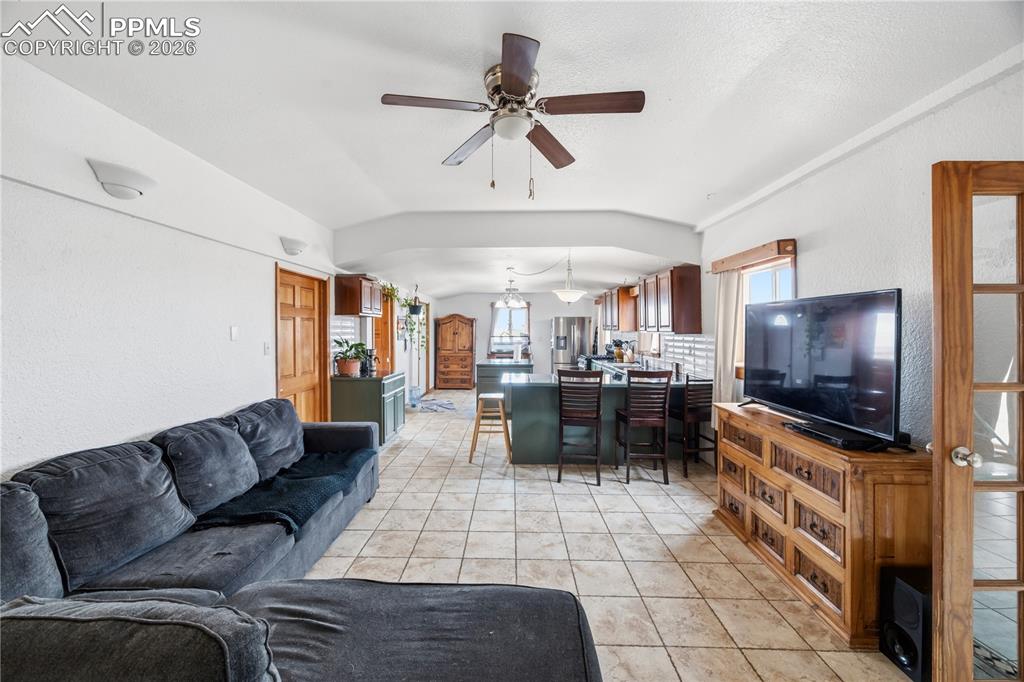 6615 Mulberry Road Calhan, CO 80808 - Photo 6 of 47 a living room with furniture and a flat screen tv