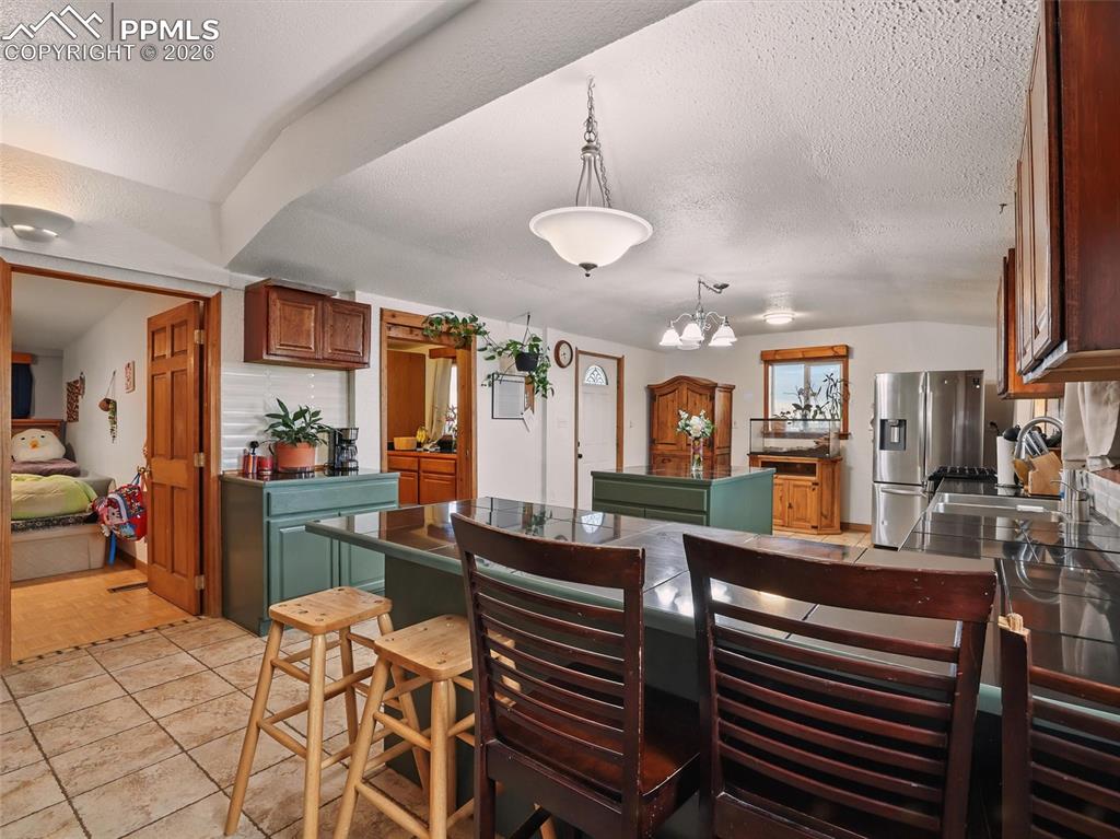 6615 Mulberry Road Calhan, CO 80808 - Photo 10 of 47 a view of a dining room with furniture