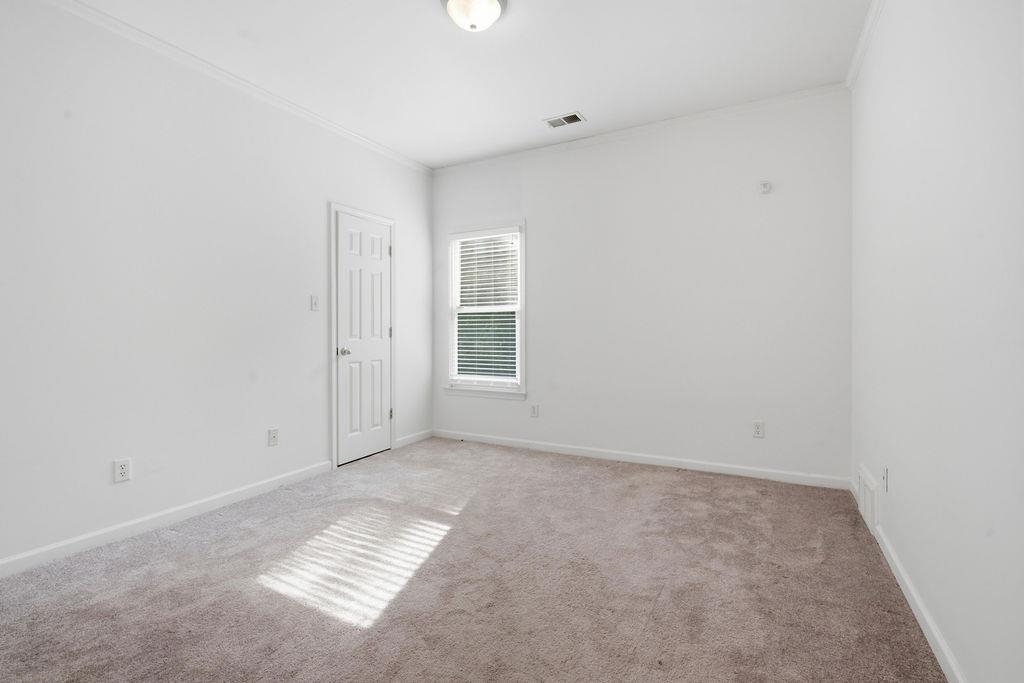 285 Great Falls Road Collierville, TN 38017 - Photo 17 of 29 Wall-to-wall carpeting with crown molding and white trim