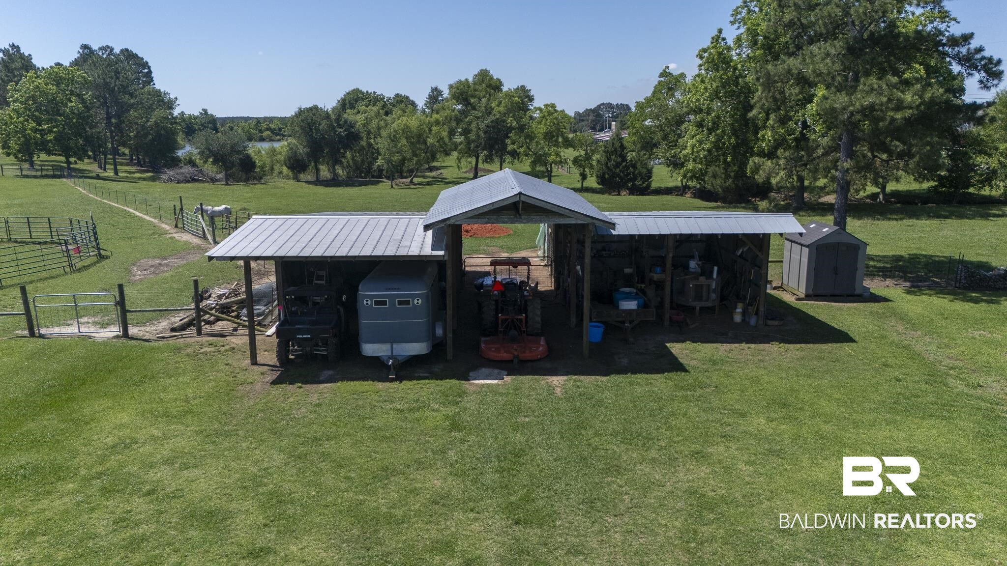 30580 County Road 49 Loxley, AL 36551 - Photo 23 of 32 Expansive covered structure with a metal roof and open bays