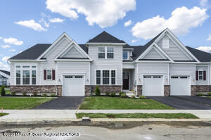 23 Gulfstream Road New Egypt, NJ 08533 - Photo 2 of 34 a front view of a house with a garden