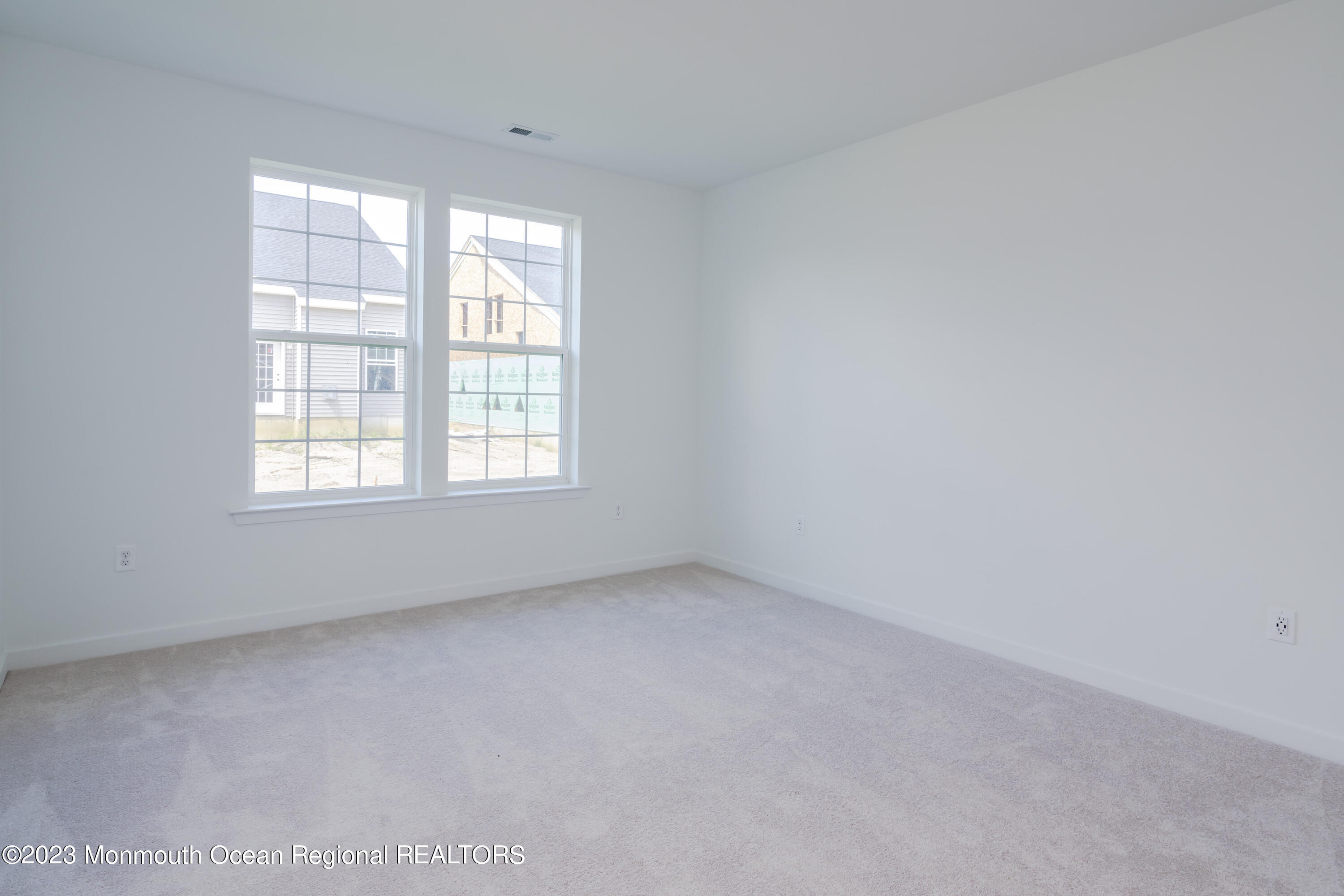 23 Gulfstream Road New Egypt, NJ 08533 - Photo 6 of 34 an empty room with a window