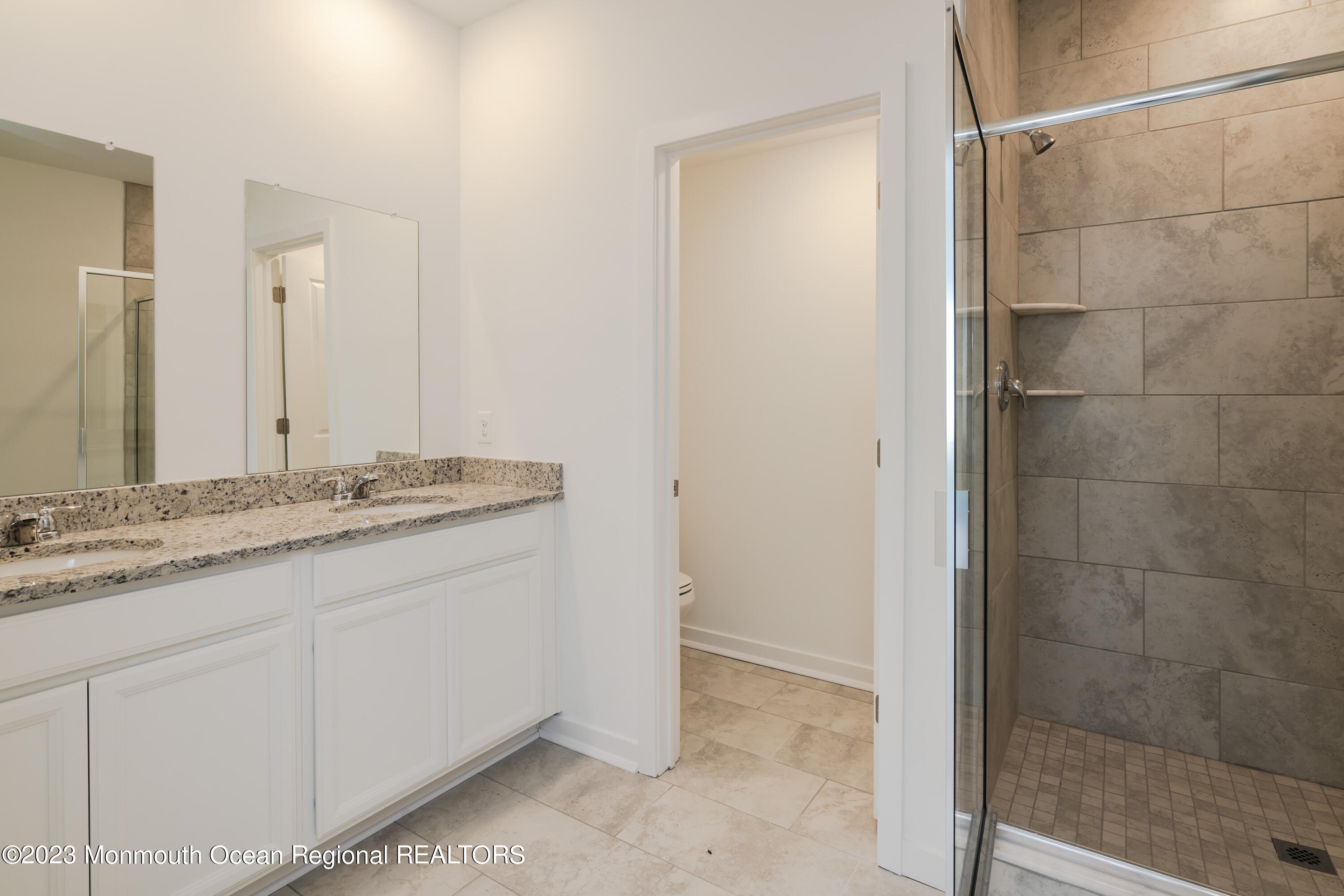 23 Gulfstream Road New Egypt, NJ 08533 - Photo 7 of 34 a bathroom with a granite countertop sink and a mirror