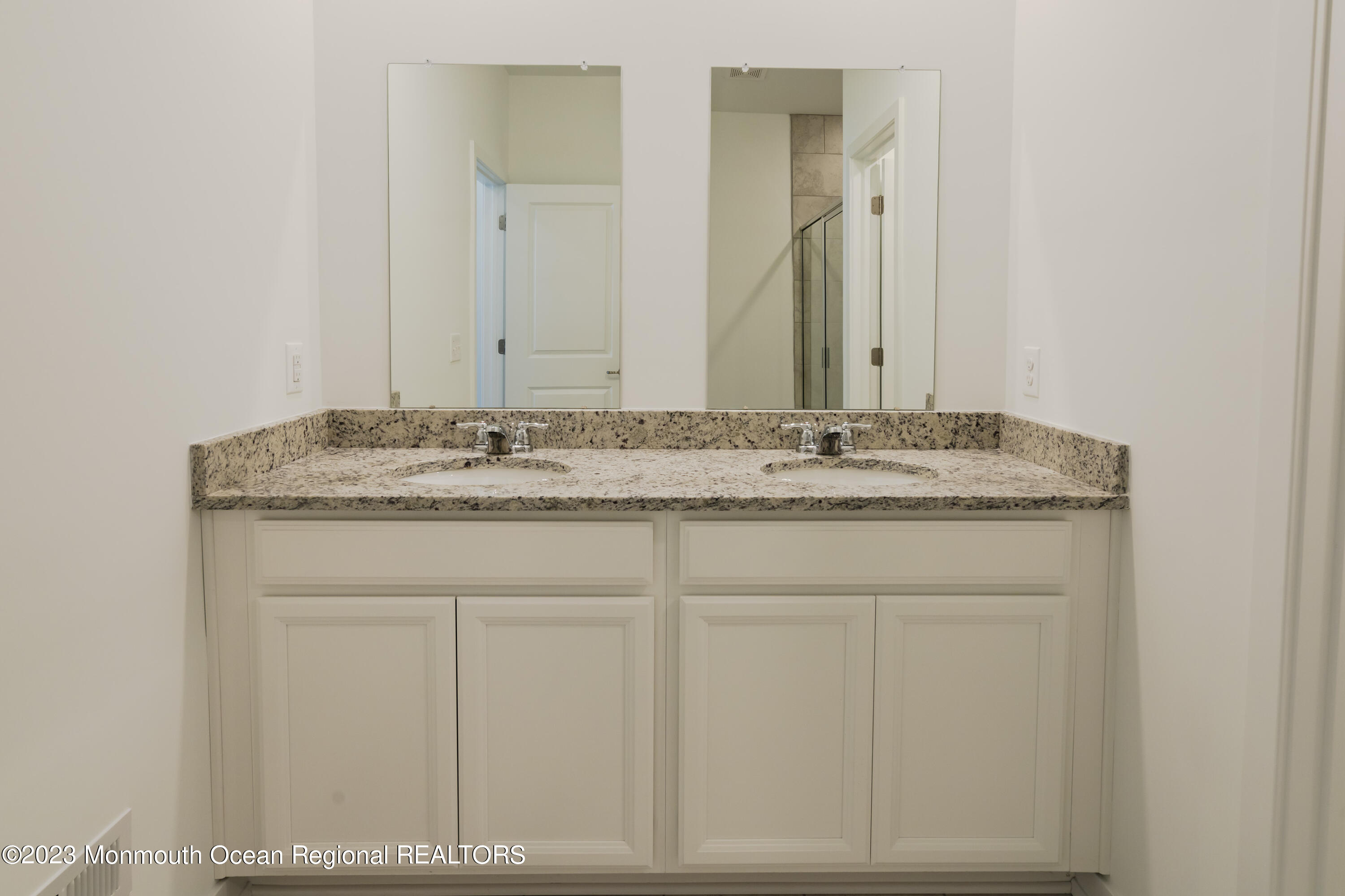 23 Gulfstream Road New Egypt, NJ 08533 - Photo 8 of 34 a bathroom with a granite countertop sink and a mirror