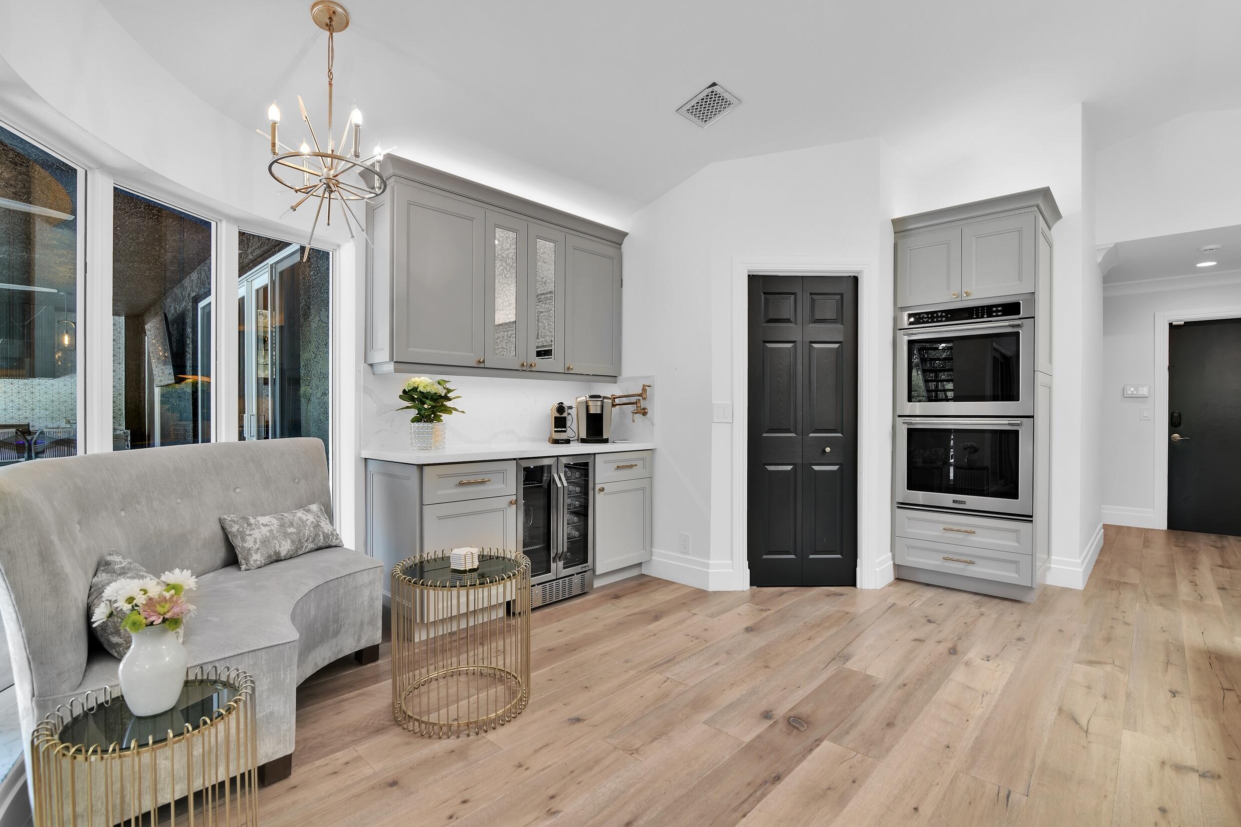 21082 North Sweetwater Lane Boca Raton, FL 33428 - Photo 23 of 75 a living room with furniture and a chandelier