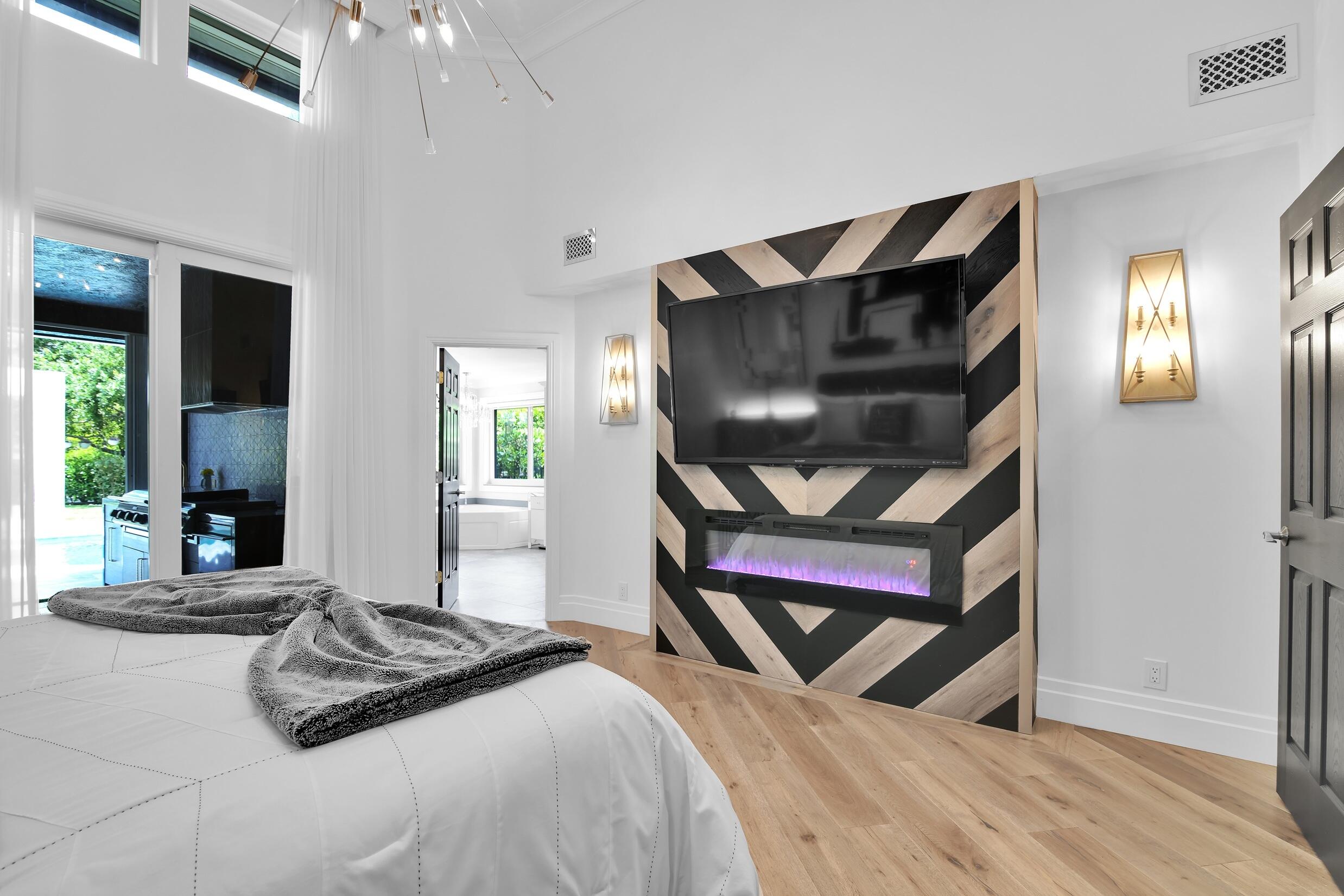 21082 North Sweetwater Lane Boca Raton, FL 33428 - Photo 34 of 75 a bedroom with a bed and a window
