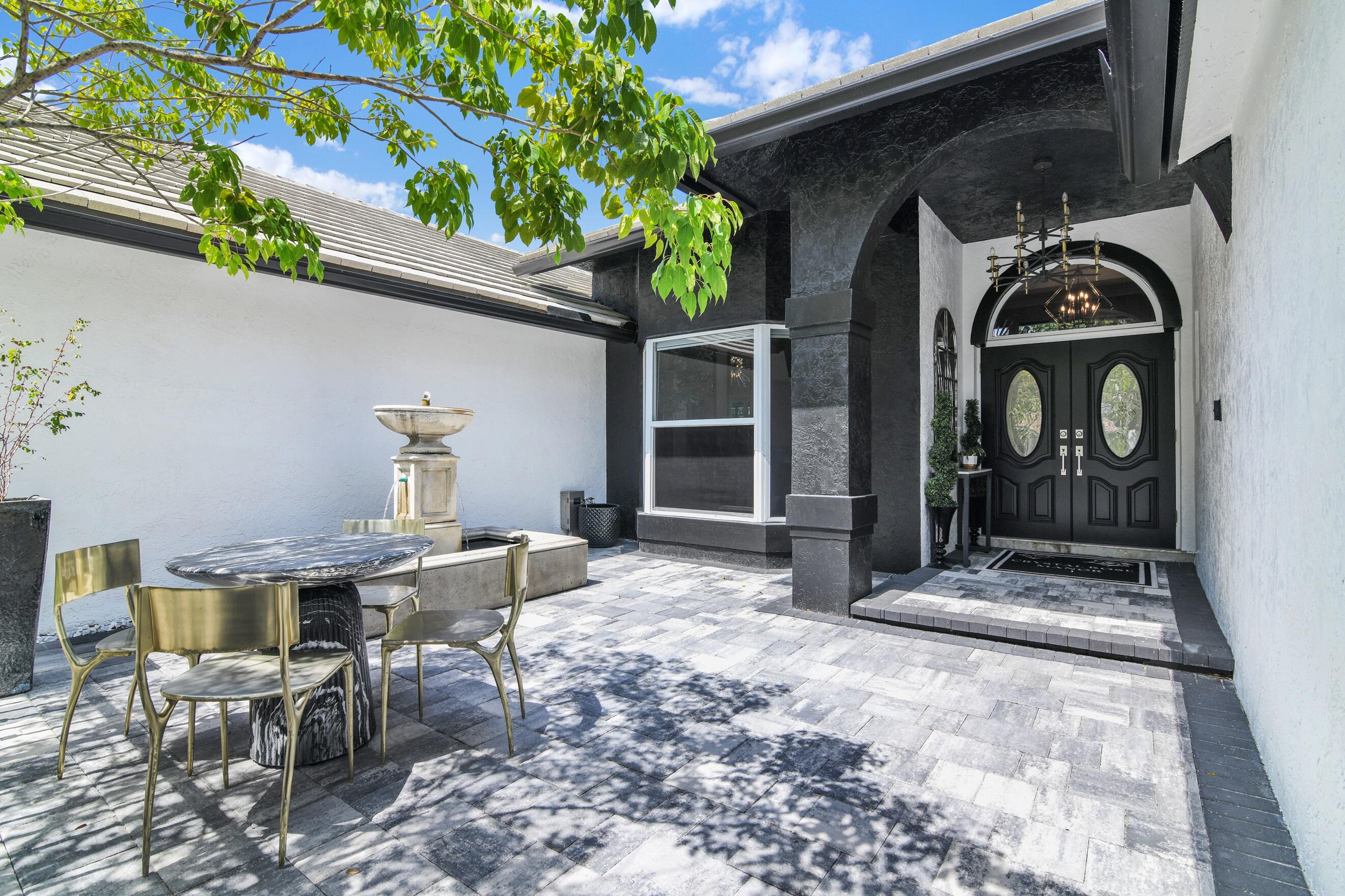 21082 North Sweetwater Lane Boca Raton, FL 33428 - Photo 4 of 75 a view of porch with seating space
