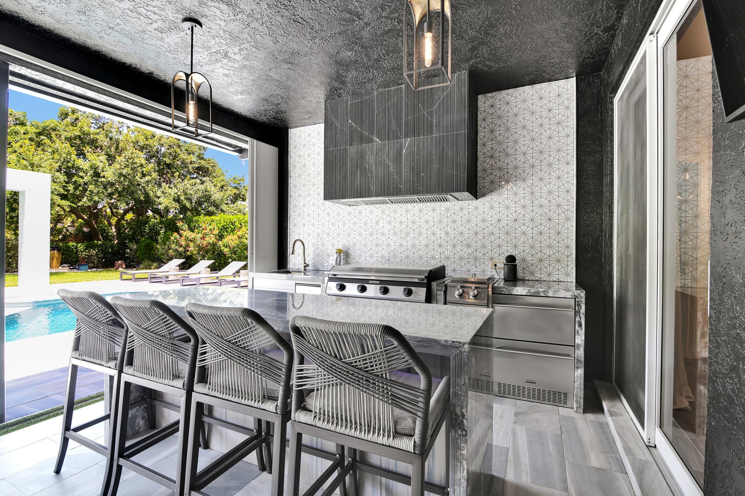 21082 North Sweetwater Lane Boca Raton, FL 33428 - Photo 41 of 75 a kitchen with a table and chairs in it