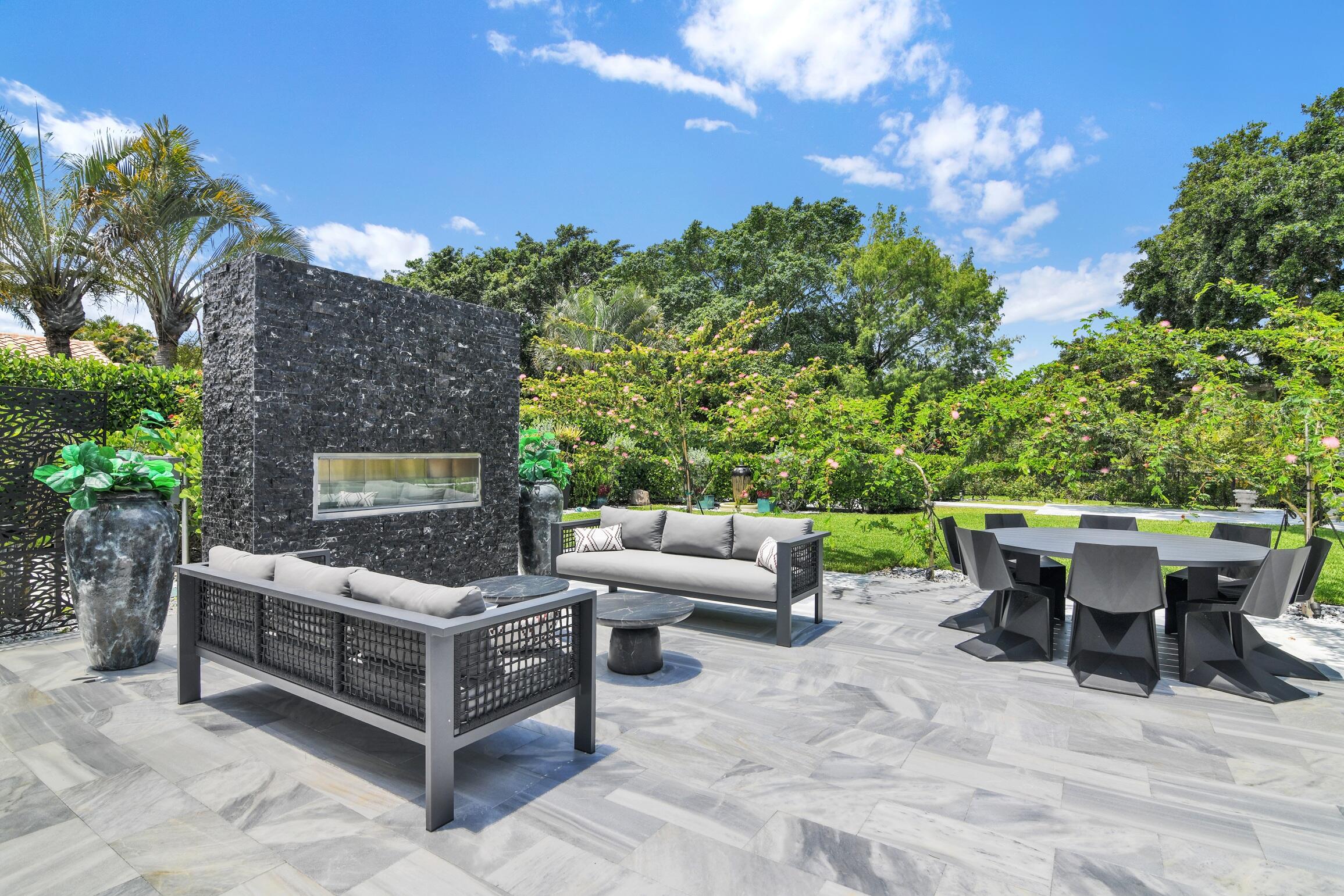 21082 North Sweetwater Lane Boca Raton, FL 33428 - Photo 44 of 75 a view of a patio with couches and potted plants