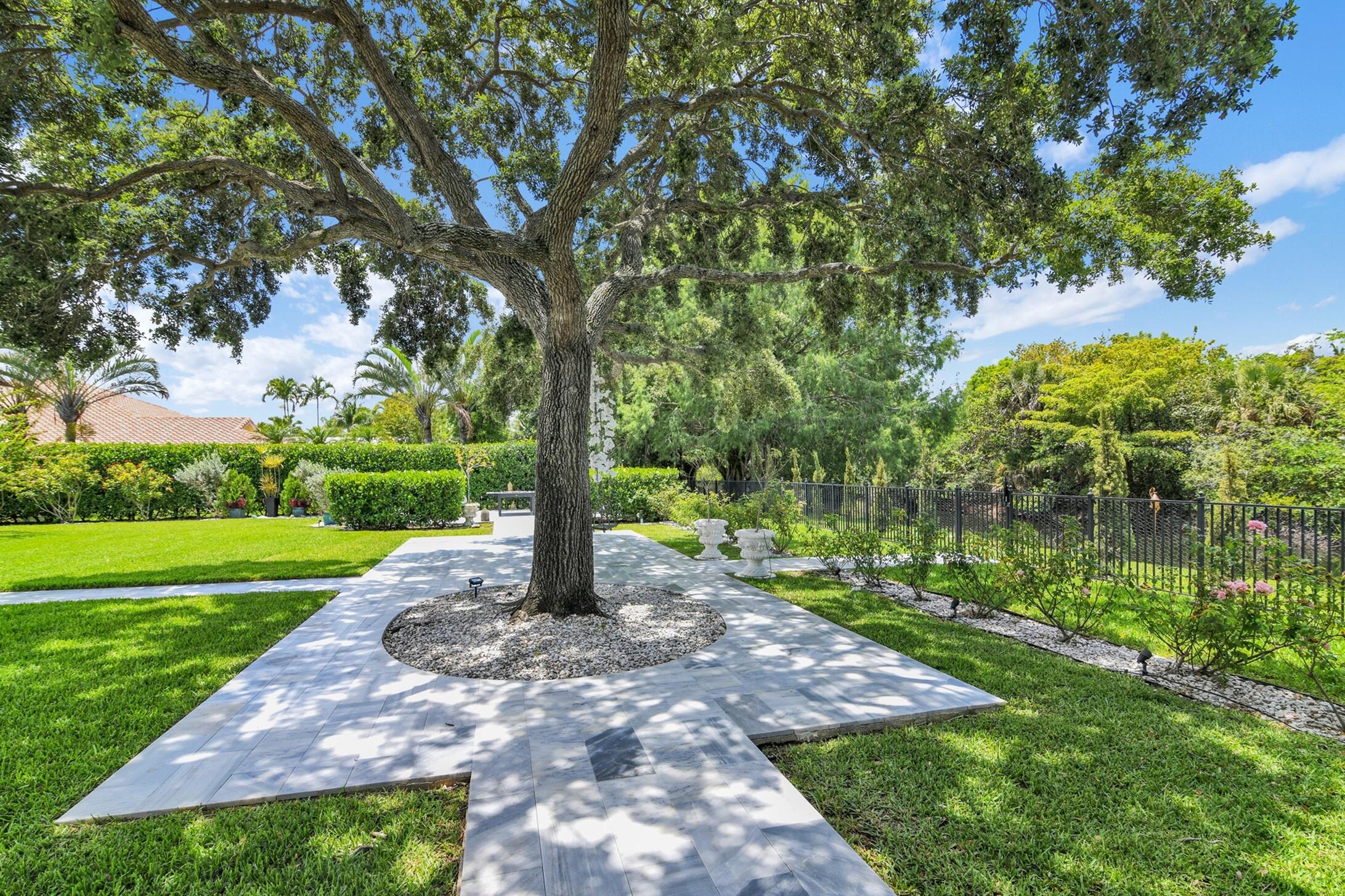 21082 North Sweetwater Lane Boca Raton, FL 33428 - Photo 49 of 75 a view of a garden with a tree