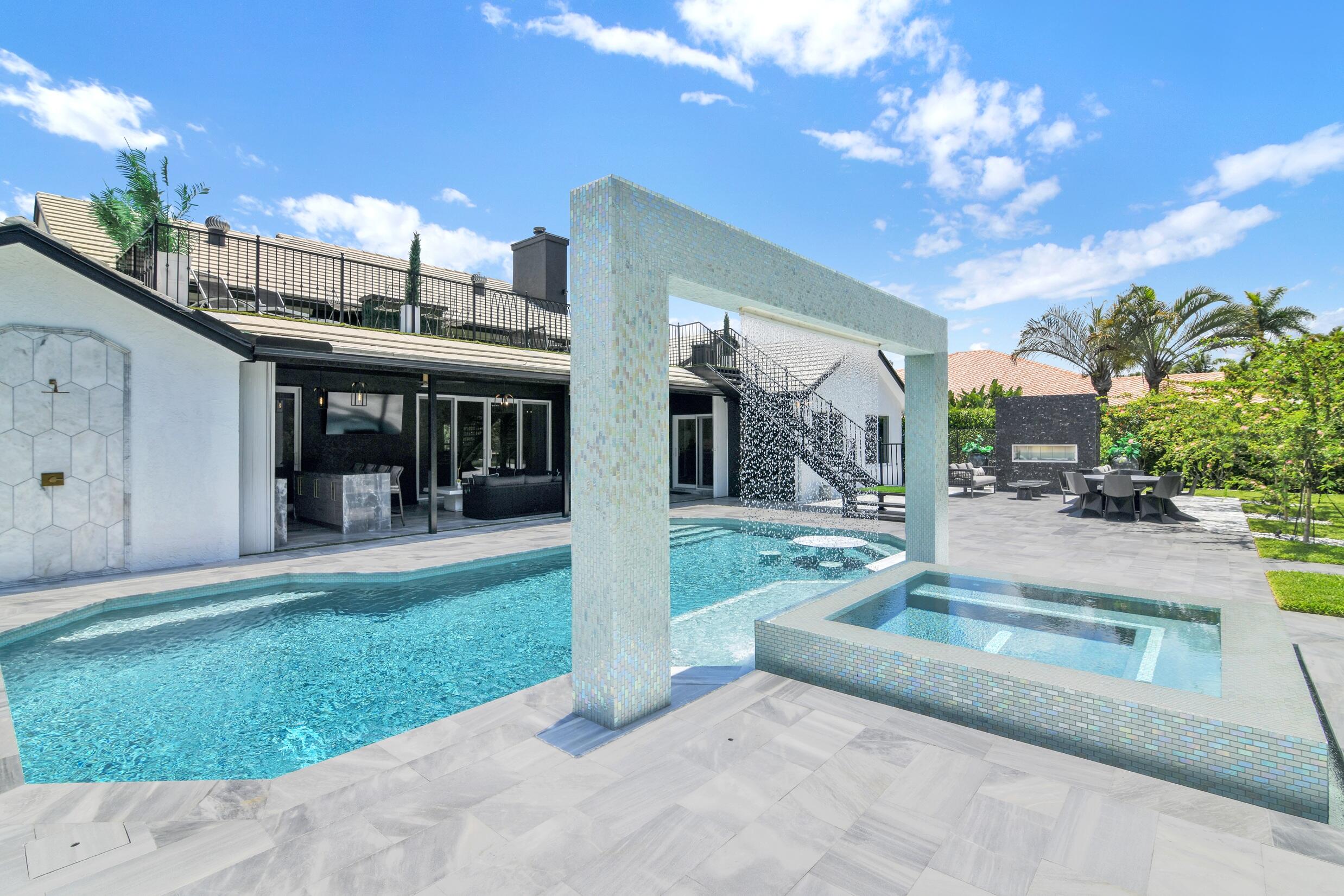 21082 North Sweetwater Lane Boca Raton, FL 33428 - Photo 54 of 75 a view of a house with a swimming pool and a yard
