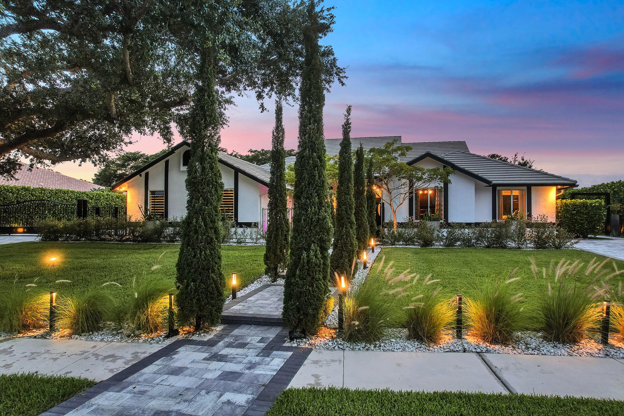 21082 North Sweetwater Lane Boca Raton, FL 33428 - Photo 60 of 75 a front view of a house with garden