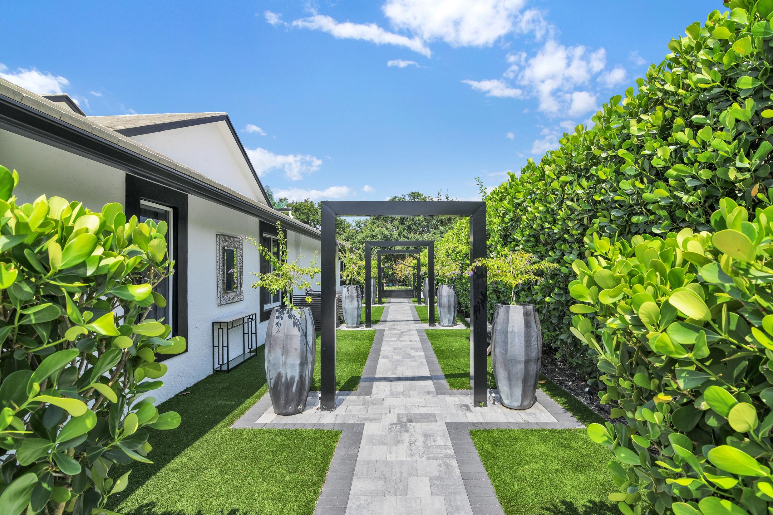 21082 North Sweetwater Lane Boca Raton, FL 33428 - Photo 6 of 75 a front view of a house with garden