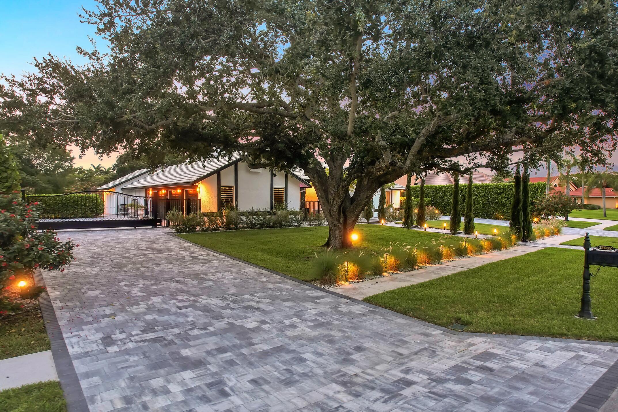 21082 North Sweetwater Lane Boca Raton, FL 33428 - Photo 62 of 75 a view of a house with a yard