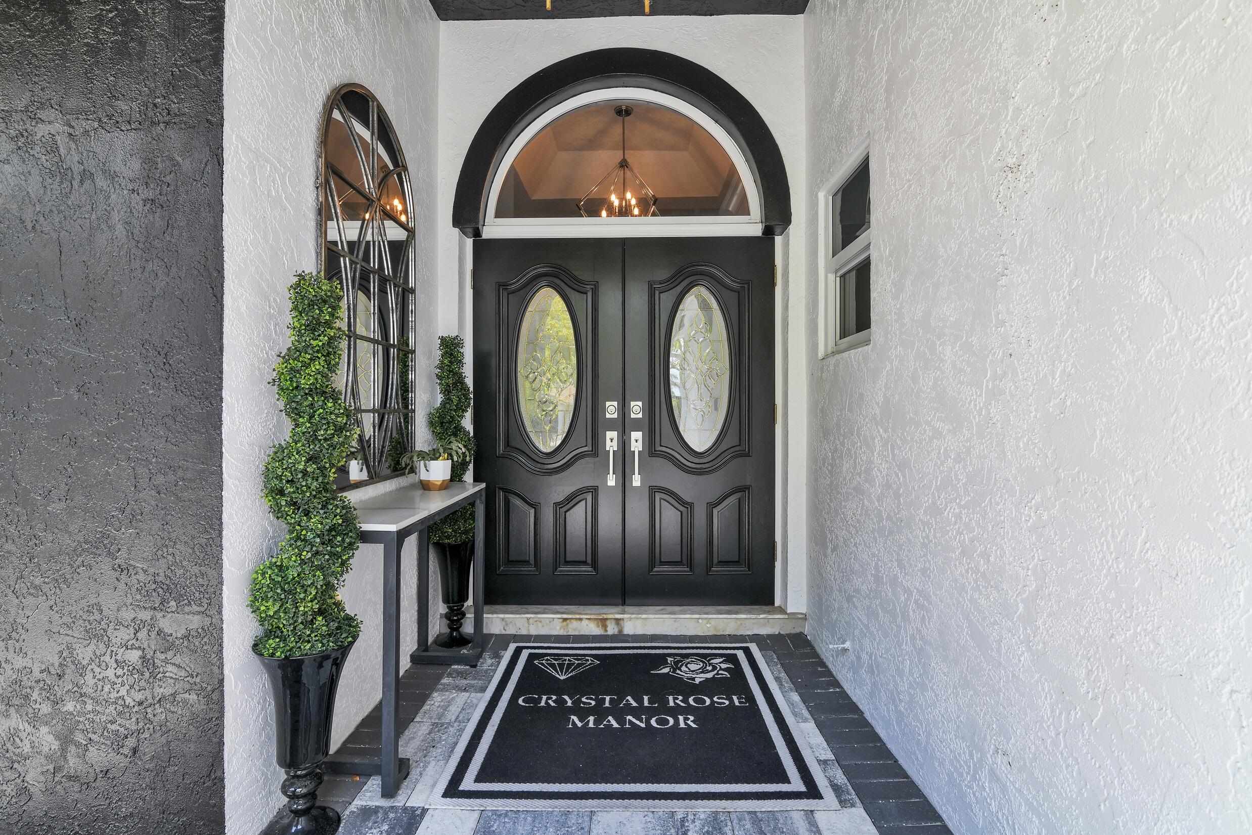 21082 North Sweetwater Lane Boca Raton, FL 33428 - Photo 8 of 75 a view of a entryway door with wooden floor