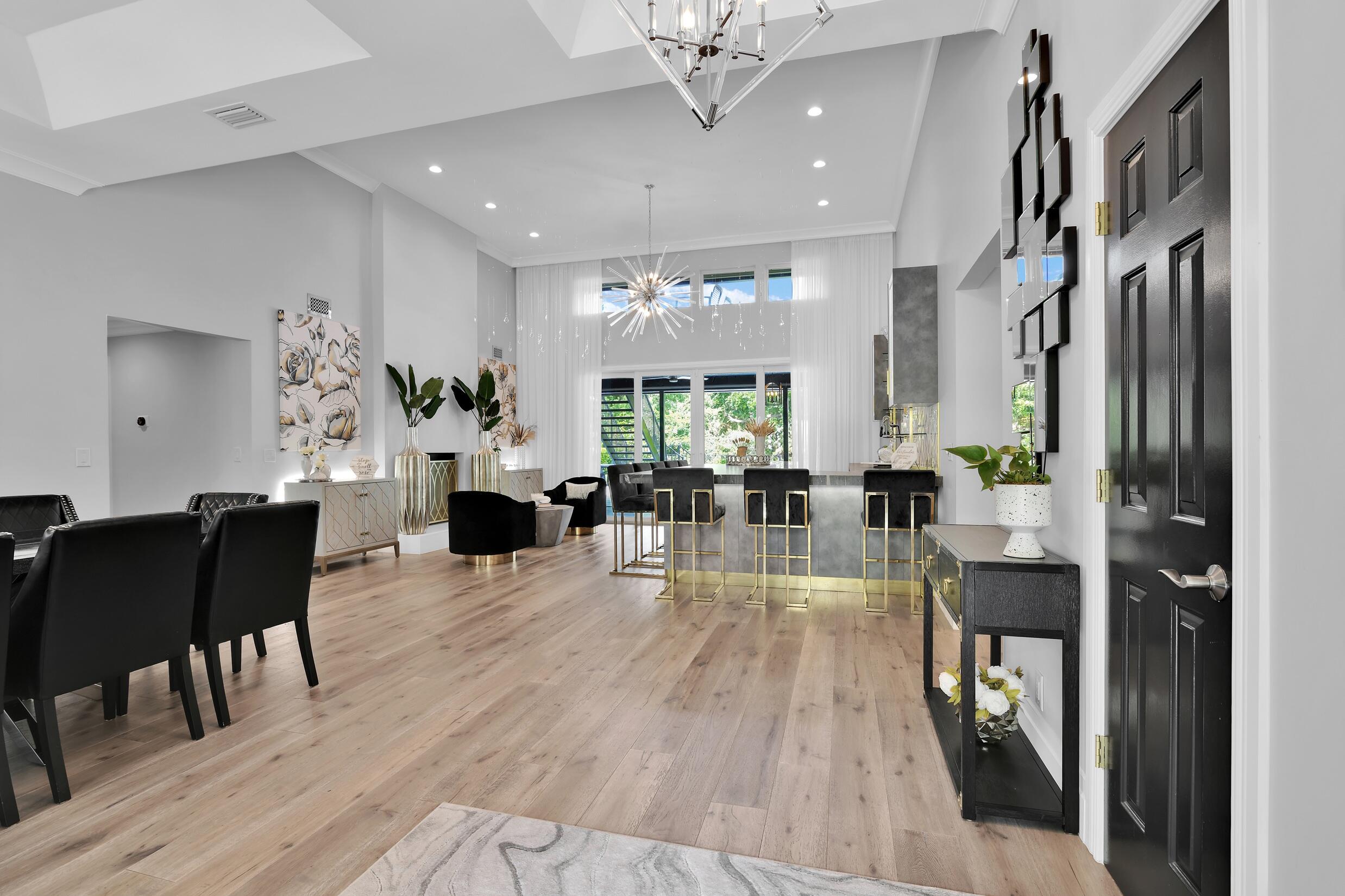 21082 North Sweetwater Lane Boca Raton, FL 33428 - Photo 9 of 75 a view of a dining room with furniture window and wooden floor