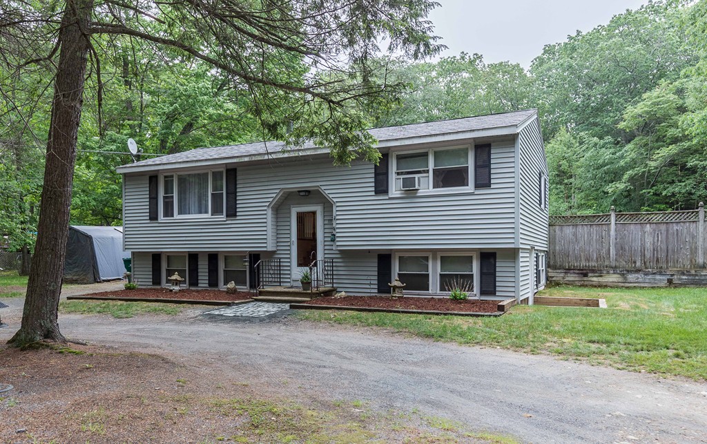 111 Sherbert Road Ashburnham, MA 01430 - Photo 1 of 18 a front view of a house with a yard