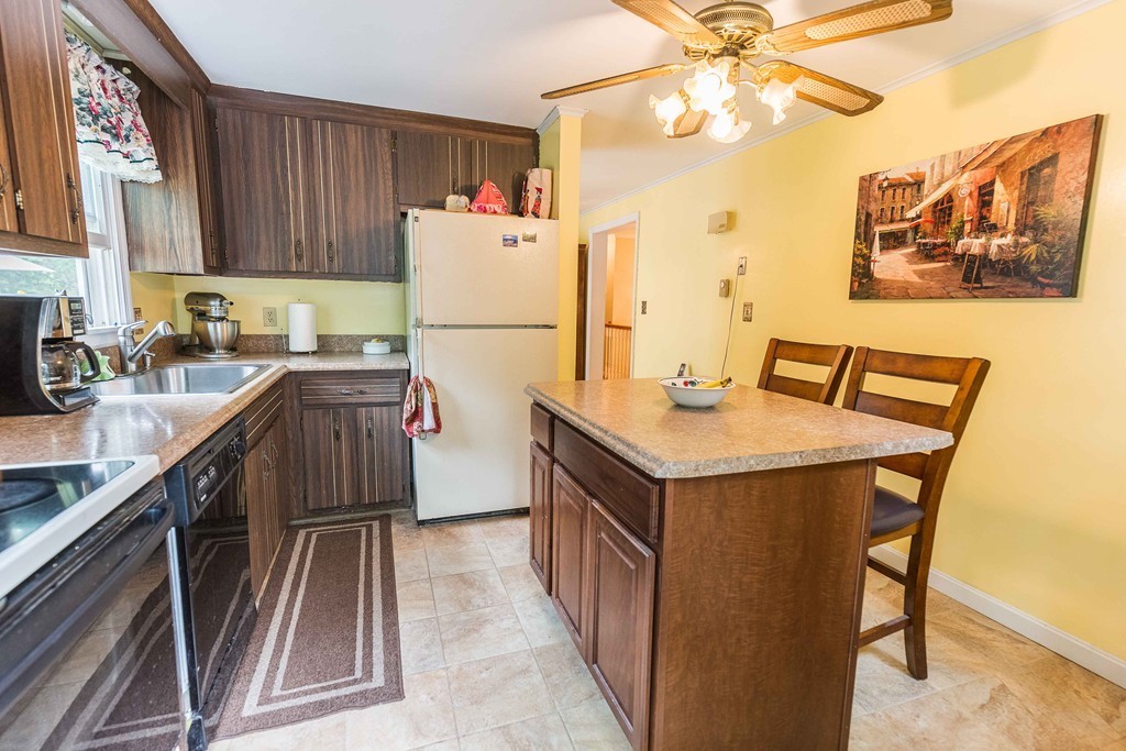 111 Sherbert Road Ashburnham, MA 01430 - Photo 3 of 18 a kitchen with a sink a refrigerator and cabinets