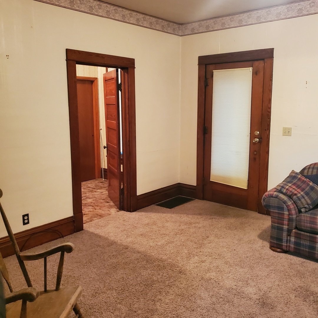 130 South 5th Street Sheldon, IL 60966 - Photo 12 of 28 a living room with furniture and a window