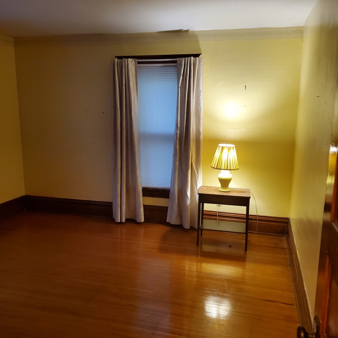 130 South 5th Street Sheldon, IL 60966 - Photo 16 of 28 a view of a room with furniture and wooden floor