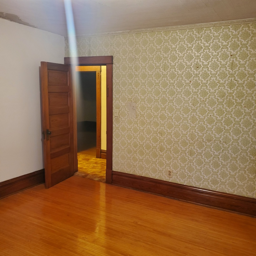 130 South 5th Street Sheldon, IL 60966 - Photo 19 of 28 a view of empty room with wooden floor