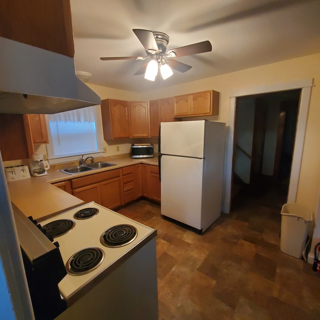 130 South 5th Street Sheldon, IL 60966 - Photo 8 of 28 a kitchen with stainless steel appliances granite countertop a refrigerator a stove a sink and a microwave