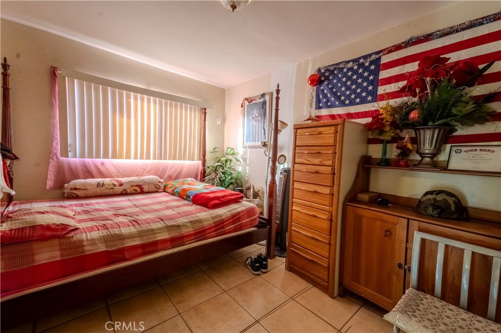 1101 Atlantic Avenue Long Beach, CA 90813 - Photo 13 of 15 a bedroom with a bed and a window